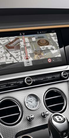 Infotainment system of Bentley Continental GT Mulliner with 12.3 inch display screen featuring HDD navigation.