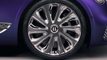 Bentley Continental GT Mulliner in Tanzanite Purple close up on 22" Mulliner Wheel Painted and Polished with Self Levelling Wheel Badge.