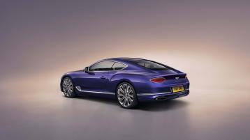 Rear side angled view of Bentley Continental GT Mulliner in Tanzanite Purple featuring Full Led tail lamps and Chrome Bentley Badge to boot. 