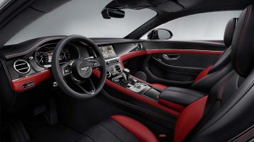 Driver side view of Bentley Continental GT S V8 overlooking passenger side, featuring Hotspur and Beluga Hide with High Gloss Carbon Fibre Veneer.