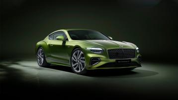 Front end of new Bentley Continental GT Speed in Tourmaline Green featuring new 21 inch Speed wheels