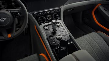 Close up of the driver controls featured in the new Continental GT Speed with a gravity grey main hide and mandarin by Mulliner secondary hide