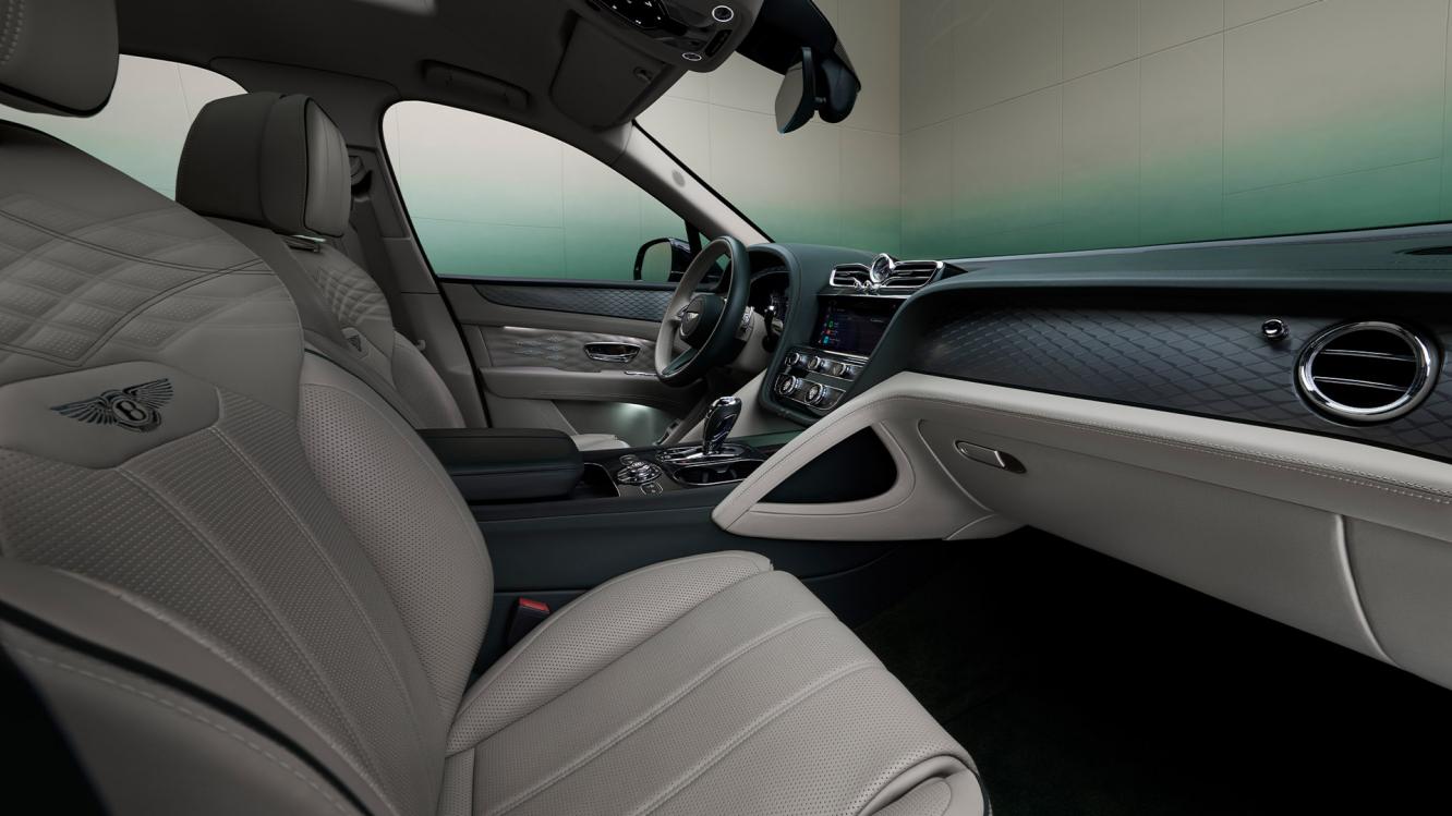 Wisdow Kaye sitting in the rear cabin of the Bentayga Atelier Edition featuring cross stitching and cumbrian green pipping