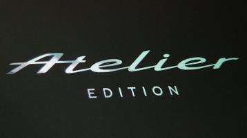 Close up of the Atelier edition animated welcome lamps displaying the cars special edition logo