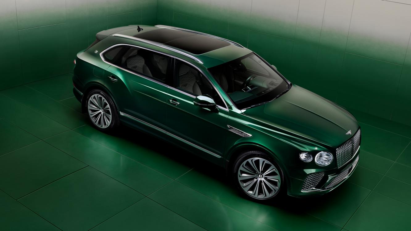 Rear three quarter of the Bentayga Atelier Edition in an Emerald exterior colours with bright chrome accents