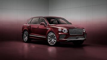 Front three quarter of the Bentayga Atelier Edition in Rubino Red exterior colour with bright chrome accents