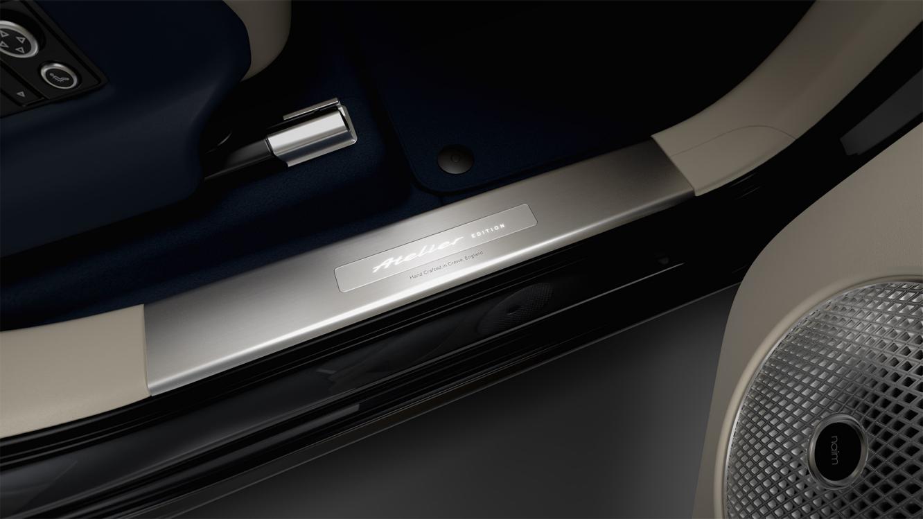 Wisdom Kaye in the drivers seat of the Bentayga Atelier Edition overlooking the illuminated threadplate