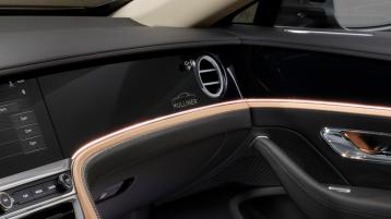 Close up of the Flying Spur Mulliner silhoutte in the handcrafted carbon fibre in the fascia of a new Flying Spur Mulliner