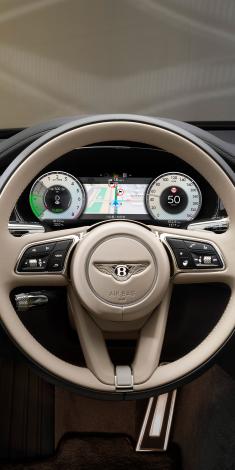 Interior view of Bentley Flying Spur Mulliner overlooking Heated, Duo-Tone, 3 Spoke, Hide Trimmed Steering Wheel.
