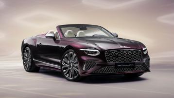 Front three quarter of the new hybrid Bentley Continental GTC Mulliner with Damson exterior colour and Mulliner exclusive 22" directional wheels