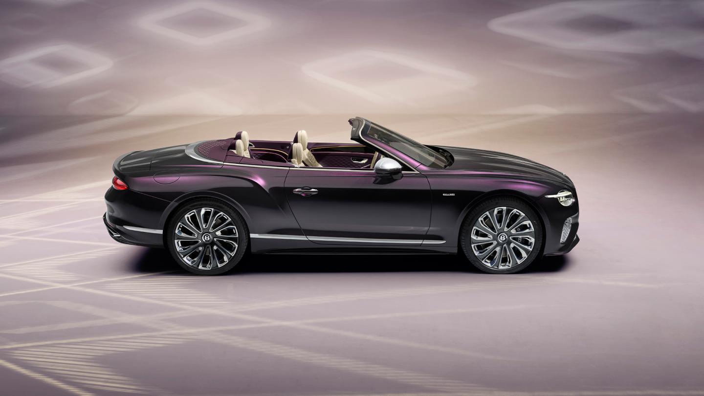 Side profile of the new hybrid Continental GTC Mulliner in Damson Green 22 inch directional and diamond cut Mulliner wheels