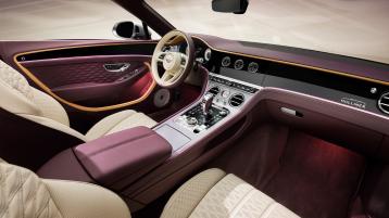 The front cabin of the new hybrid Bentley Continental GTC Mulliner with a exclusive Mulliner colour split with Linen main hide and Damson secondary hide