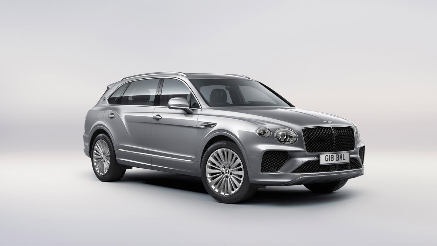 Bentley Bentayga EWB in Moonbeam paint, front three-quarter view, featuring a matrix grille and elliptical jewel cut LED headlights.