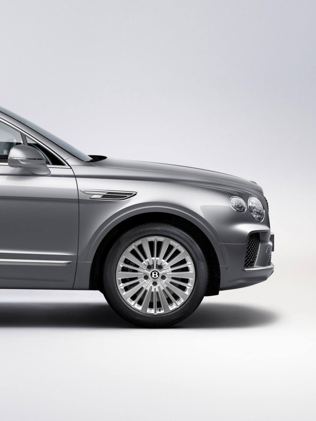 Front side angled view Bentley Bentayga in Moonbeam colour featuring 21 inch Five Twin - Spoke Wheel - Painted.