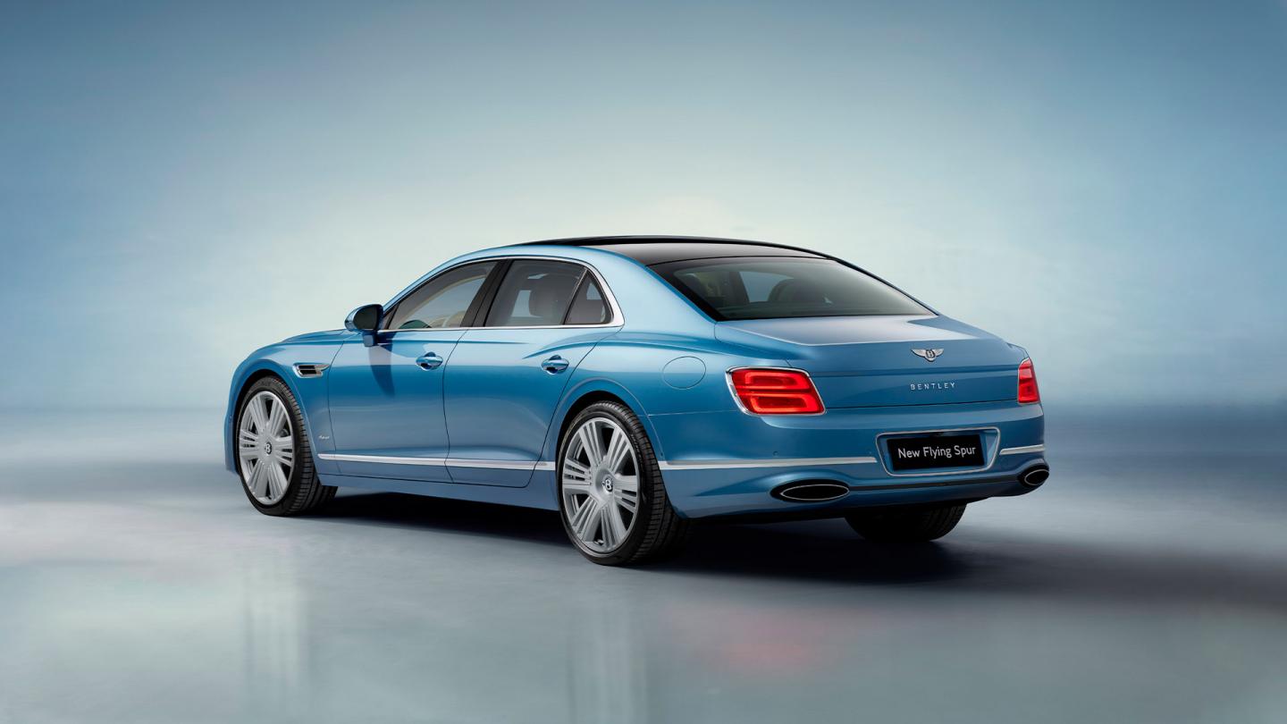 Rear side angled view of Bentley Flying Spur Azure V8 in Light Windsor Blue colour 22 inch Ten Spoke Wheel, Black Painted and Bright machined wheels.