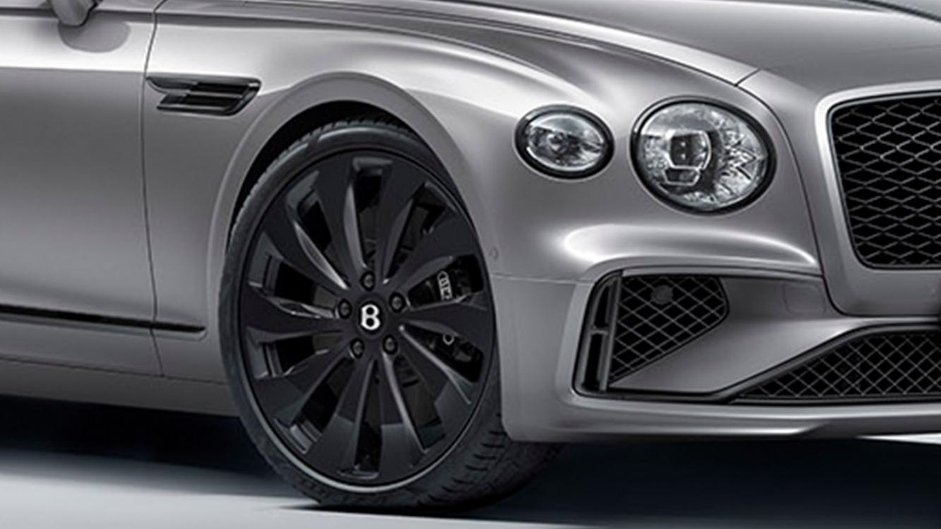 Close up of the new hybrid Flying Spur featuring the Dark Design Specification with Black Brightware and a Black 22' directional wheel