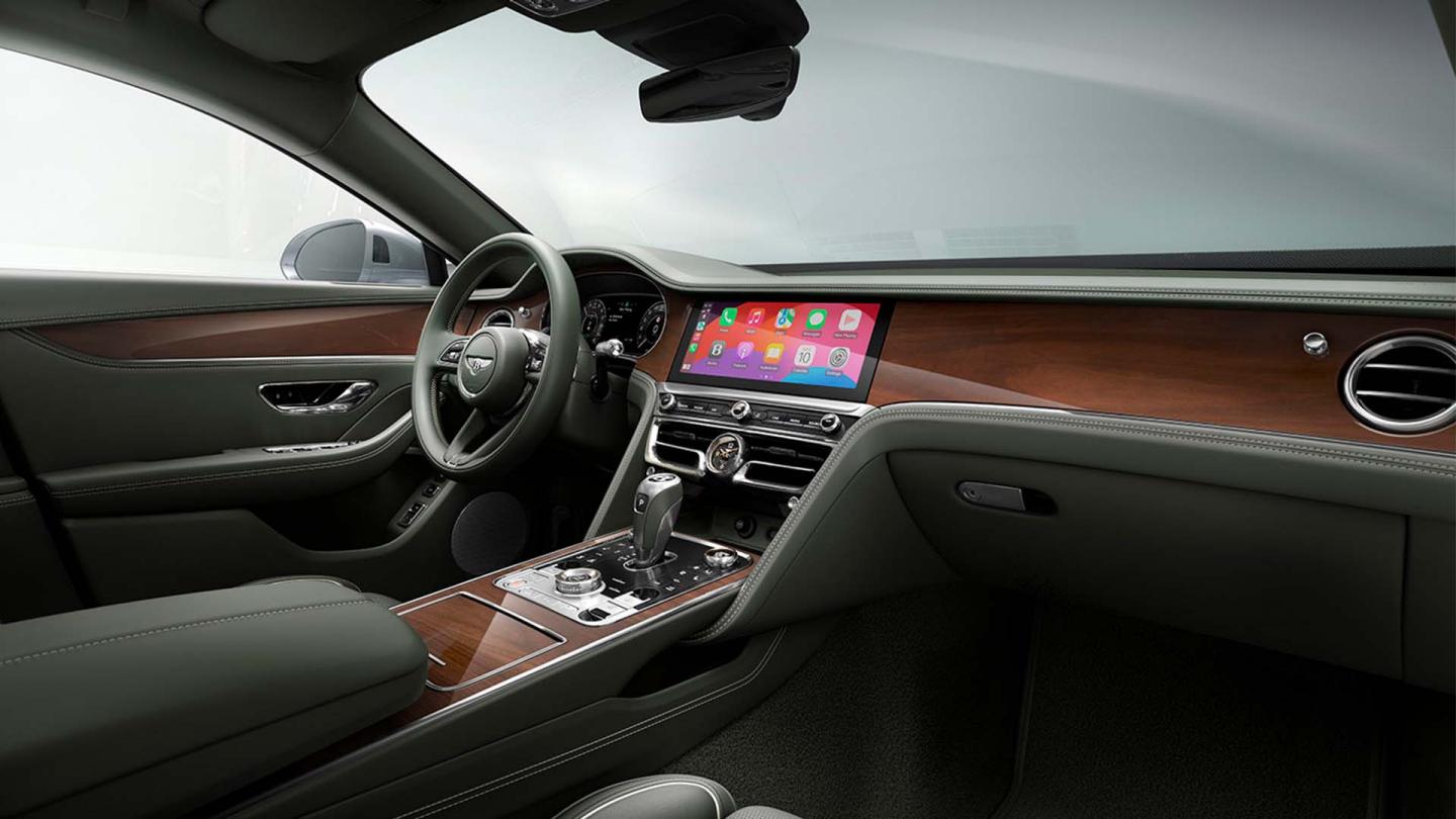 Front cabin of the new hybrid Flying Spur featuring Beluga primary hide and Open Core Koa Wood veneer