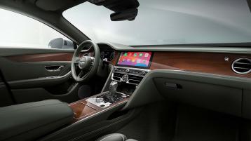 Front cabin of the new hybrid Flying Spur featuring Beluga primary hide and Open Core Koa Wood veneer