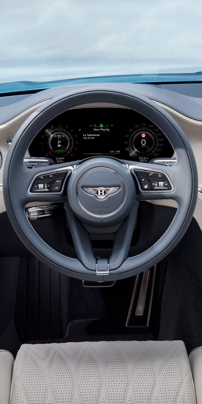 Drivers view of the steering wheel and drivers display in the new Continental GTC Azure