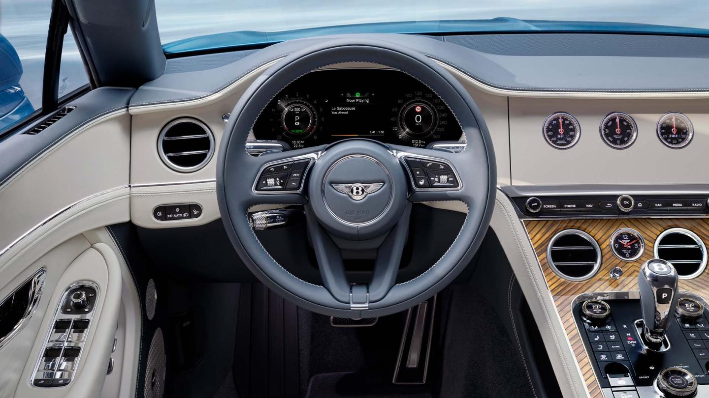 Drivers view of the steering wheel and drivers display in the new hybrid Bentley Continental GT Azure