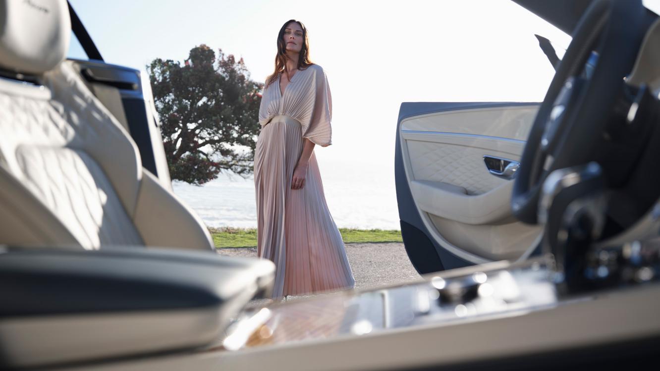 Model looking into the front cabin of the new Bentley Continental GT Azure