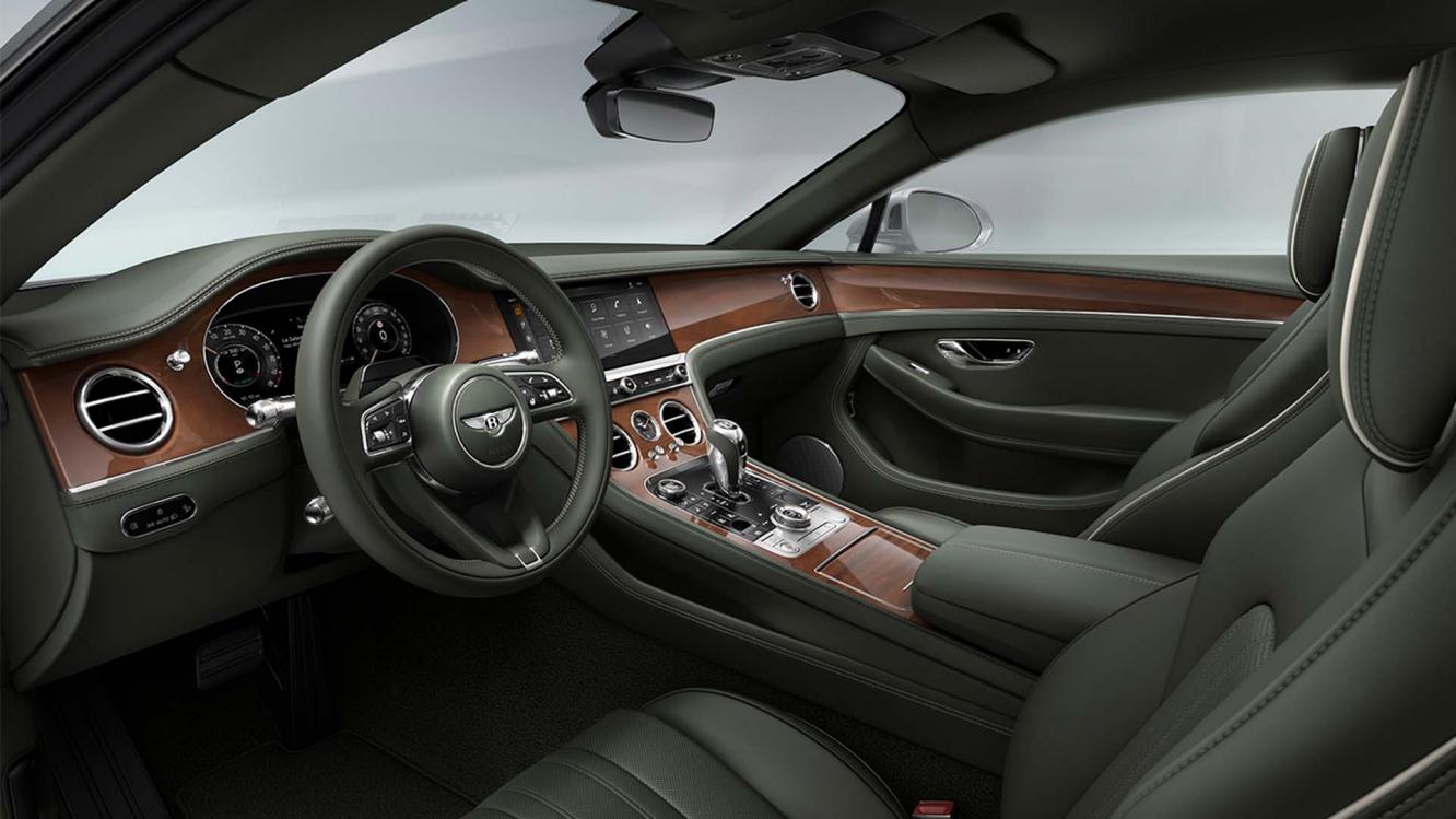 The front cabin of the new hybrid Bentley Continental GT Mulliner with a exclusive Mulliner colour split with Linen main hide and Damson secondary hide