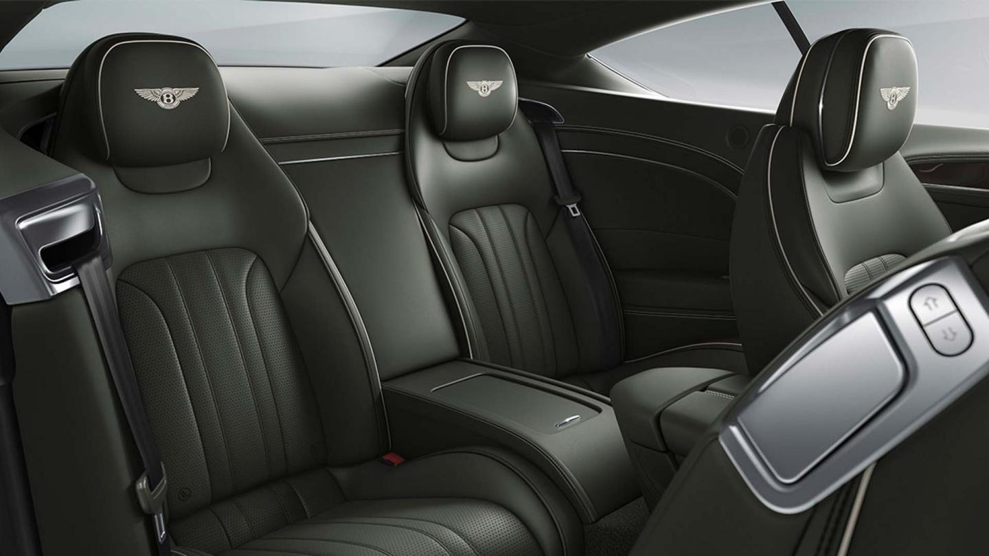 The rear cabin of the new hybrid Bentley Continental GT Mulliner with a exclusive Mulliner colour split with Linen main hide and Damson secondary hide