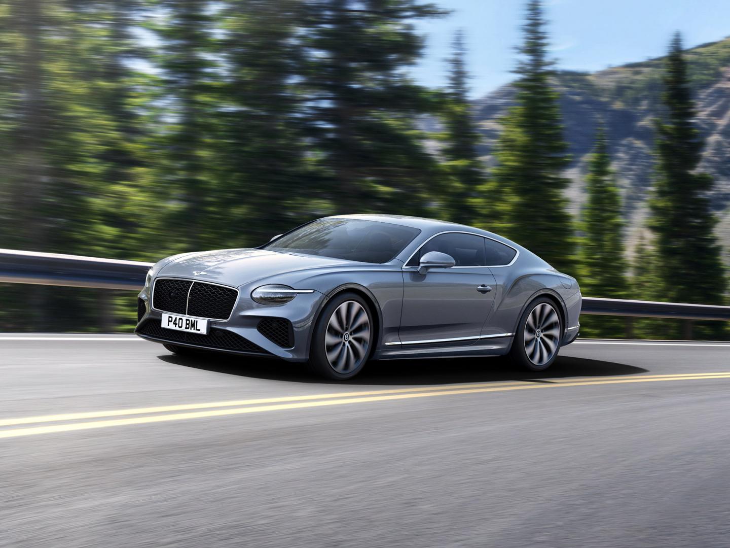 Front three quarter of the new hybrid Bentley Continental GT Mulliner with a Patina exterior colour and exclusive Mulliner 22" directional wheels
