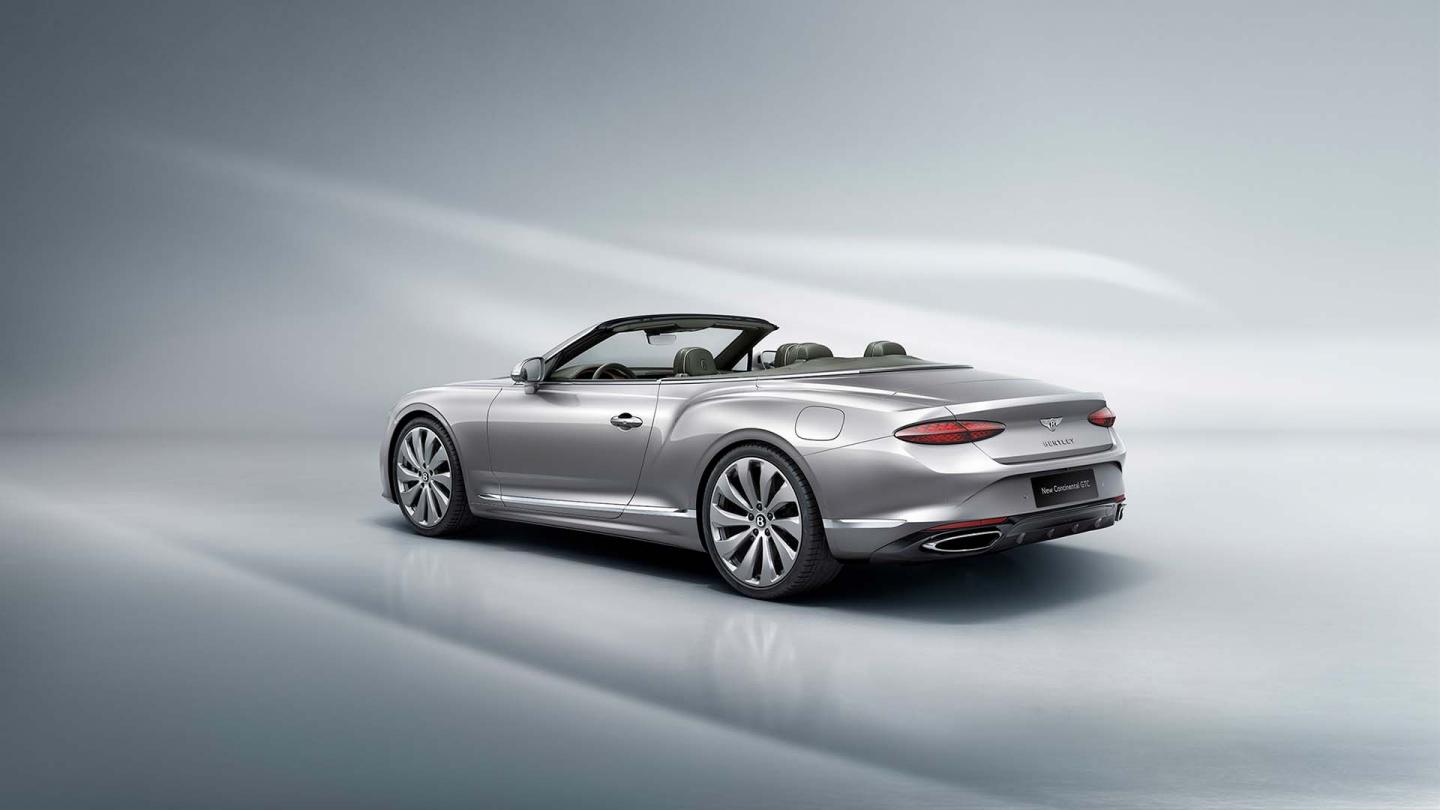 Rear three quarter of the new Continental GTC in moonbeam featuring 22 inch polished directional wheels