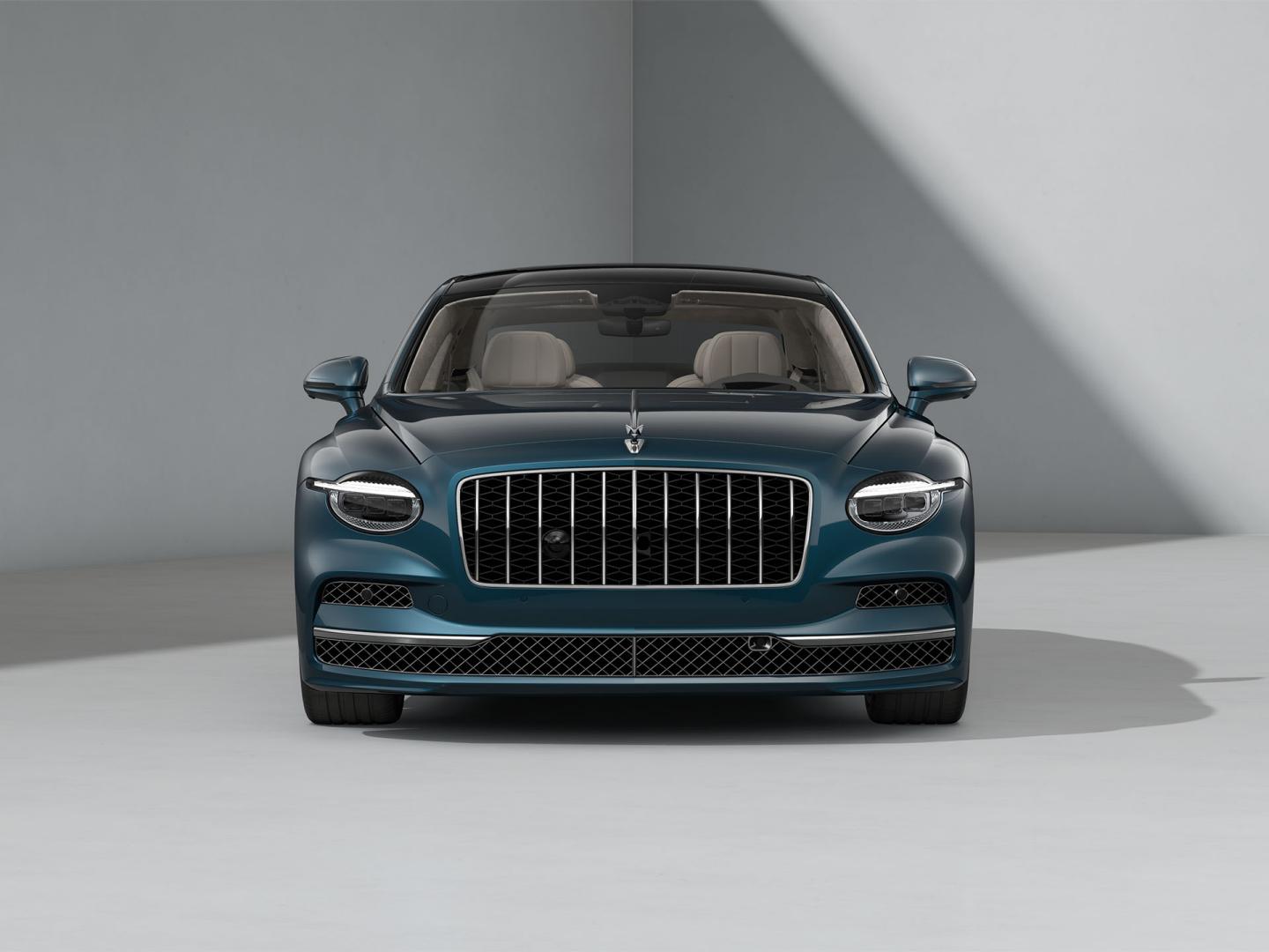 Front-on shot of the Bentley Flying Spur Azure in Dark Teal with Bright Chrome Exterior detailing.