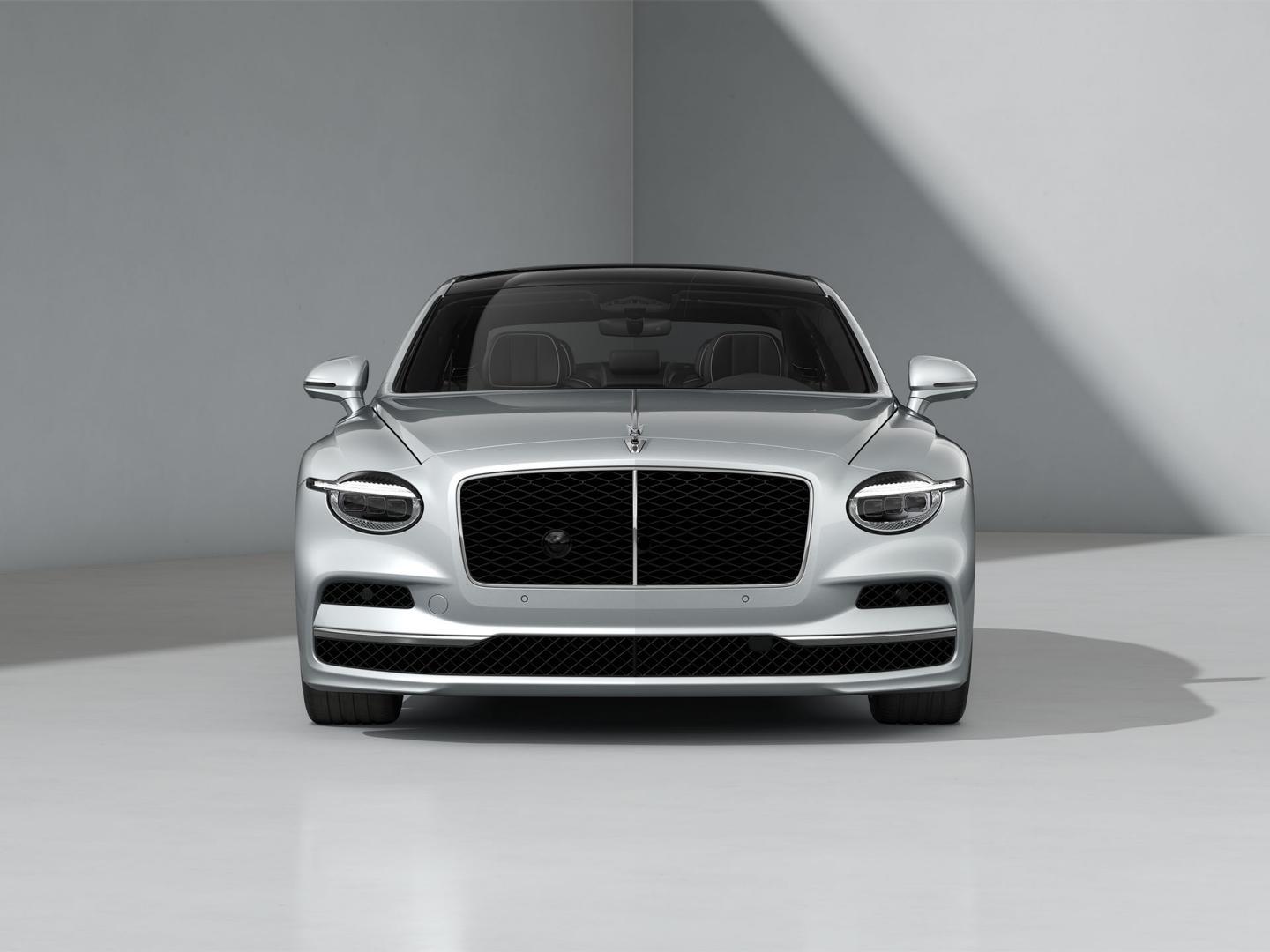 Front-on shot of the Bentley Flying Spur in Moonbeam with Bright Chrome Exterior detailing.