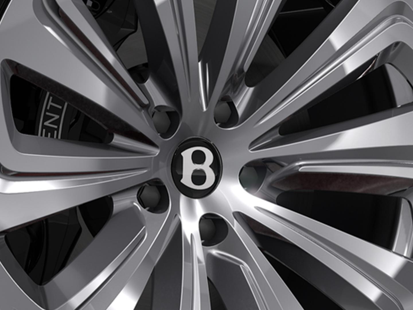 Bentayga EWB Azure SUV in Cricket Ball paint with 22" Ten Spoke Wheel close up of single wheel