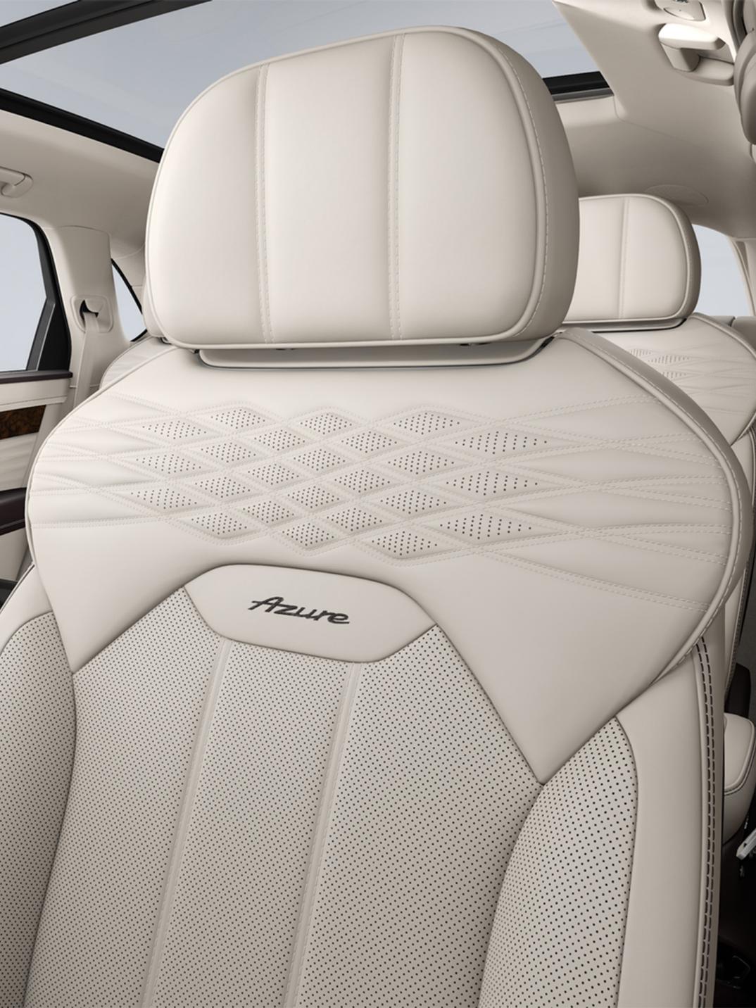 Close up of the drivers seat in a Bentley Bentayga EWB Azure with Linen Main Hide, Damson secondary hide and wellness quilting