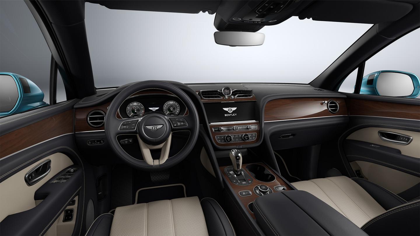 Bentley Bentayga EWB in Moonbeam paint, front three-quarter view, featuring a matrix grille and elliptical jewel cut LED headlights.