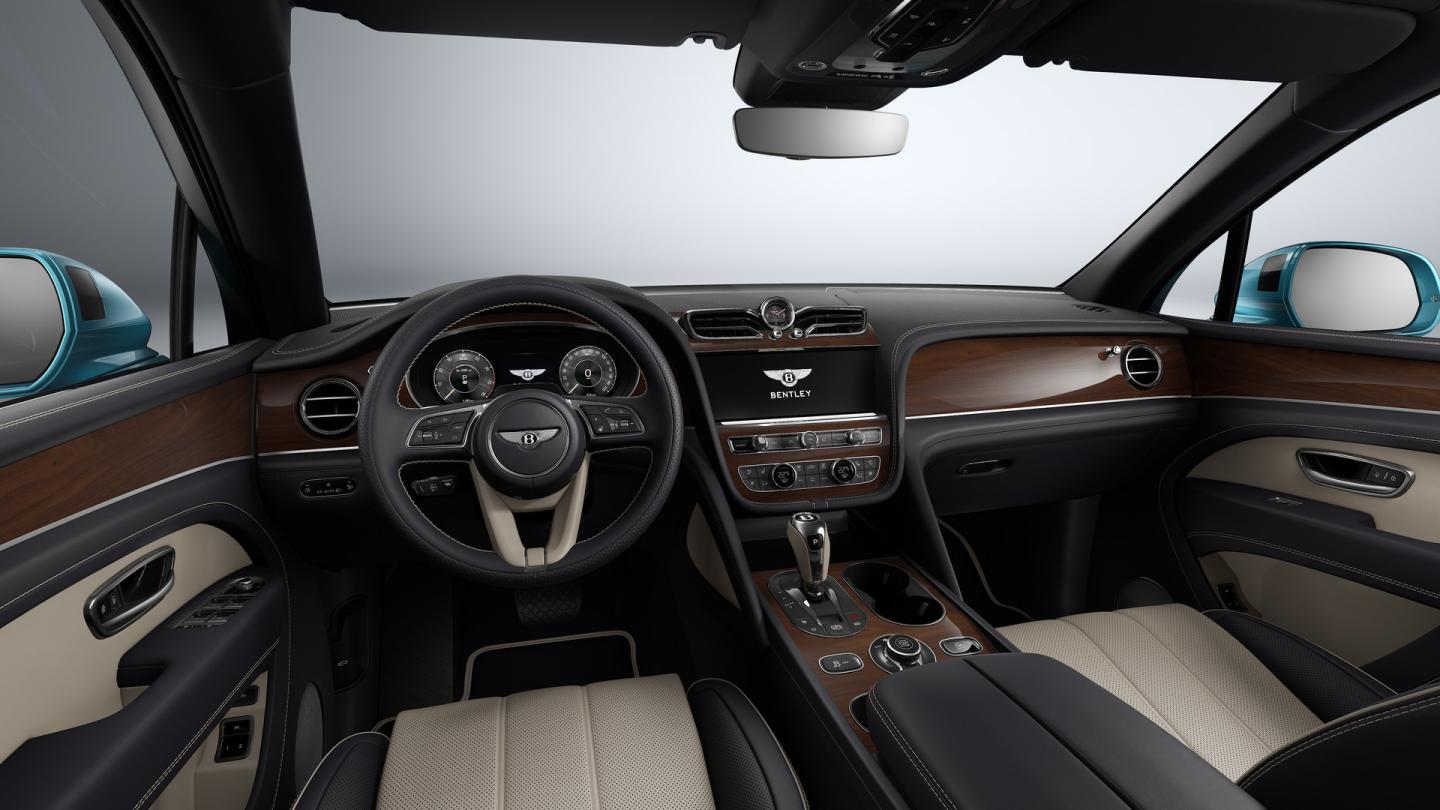 Bentley Bentayga EWB in Moonbeam paint, front three-quarter view, featuring a matrix grille and elliptical jewel cut LED headlights.