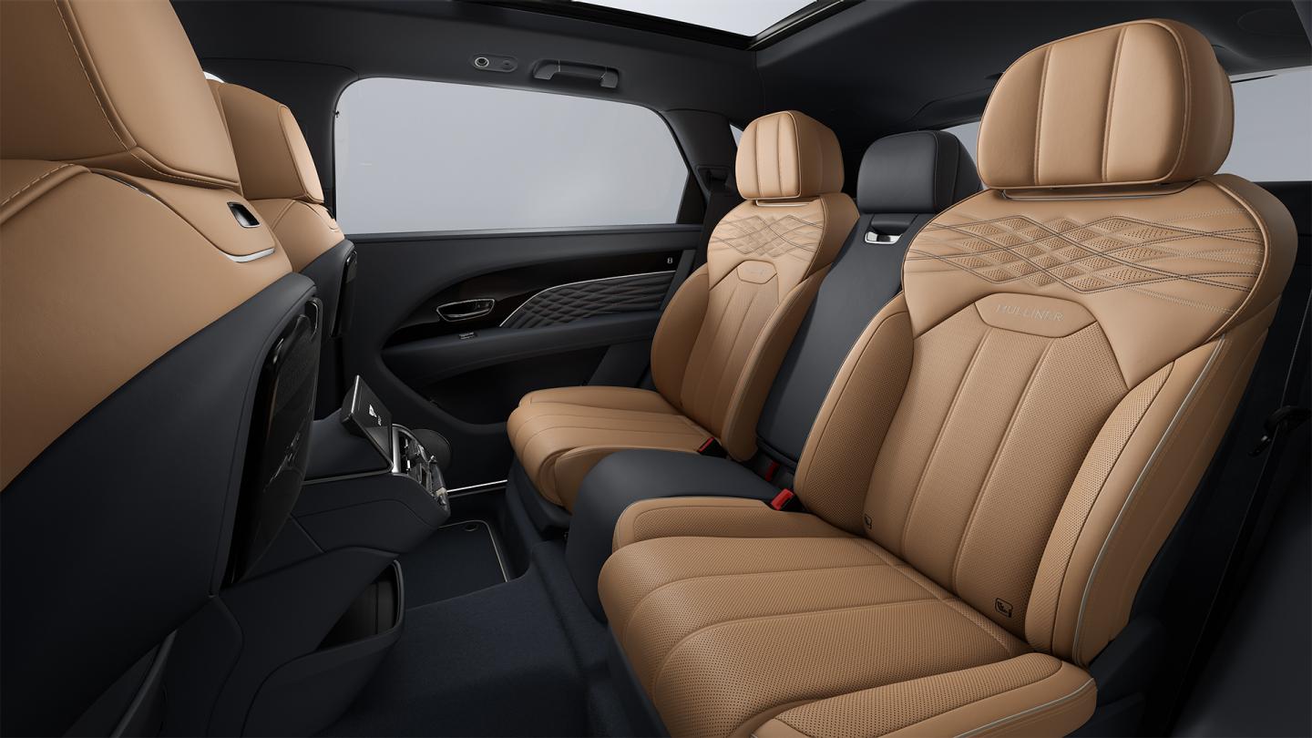 The rear cabin of a Bentley Bentayga EWB Mulliner with Camel main hide and Brunel secondary hide