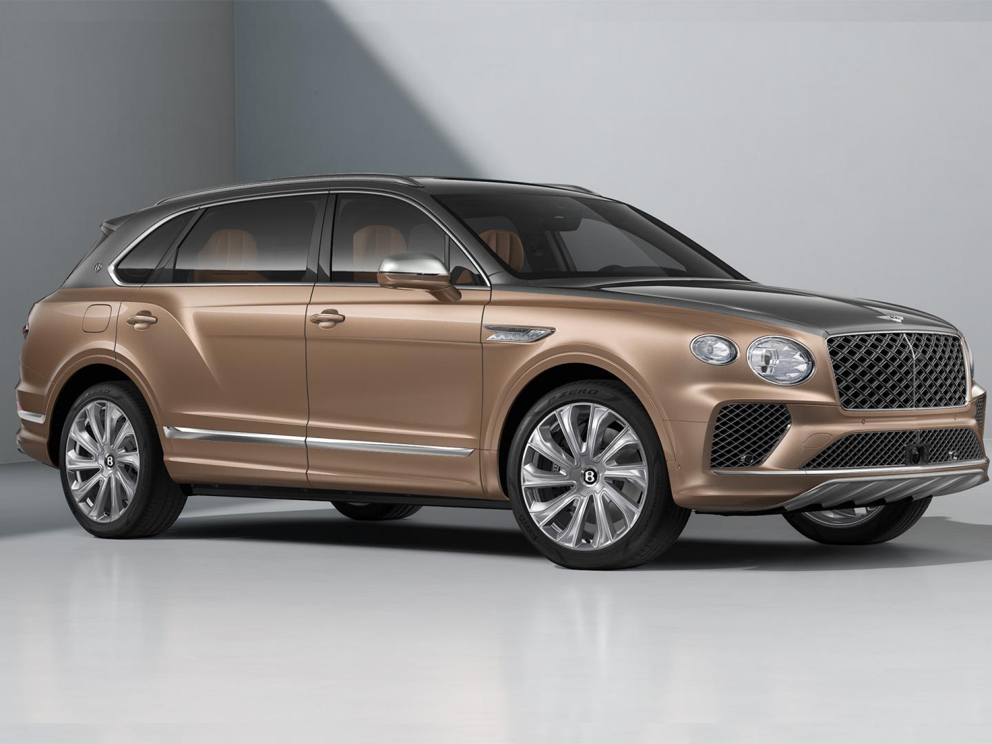 Tanzanite Purple Bentayga EWB Mulliner side profile on 22" directional Mulliner wheels driving in an urban environment