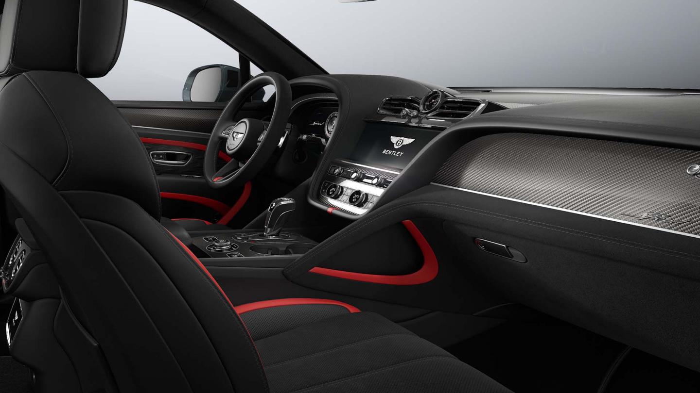 Bentley Bentayga Speed SUV in Pillar Box Red and Beluga hides with  Carbon Fibre veneer image of front cabin from side