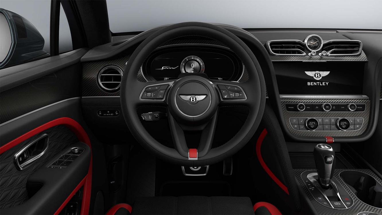 Bentley Bentayga Speed drivers view of the steering wheel featuring Pillar Box Red Main Hide and Beluga Secondary Hide