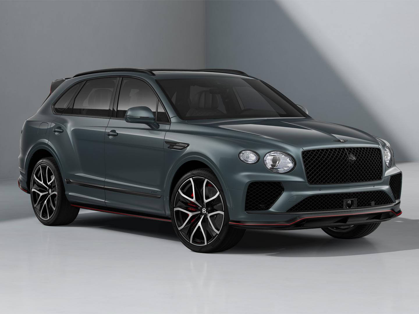 Bentley Bentayga Speed SUV in Storm Grey Satin paint with 23 inch Black Painted and Bright Machined Wheels front three quarter