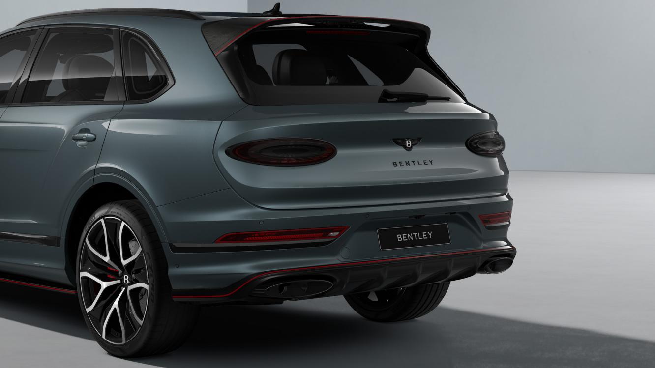 Bentley Bentayga Speed SUV in Storm Grey Satin paint with 23 inch Black Painted and Bright Machined Wheels rear 