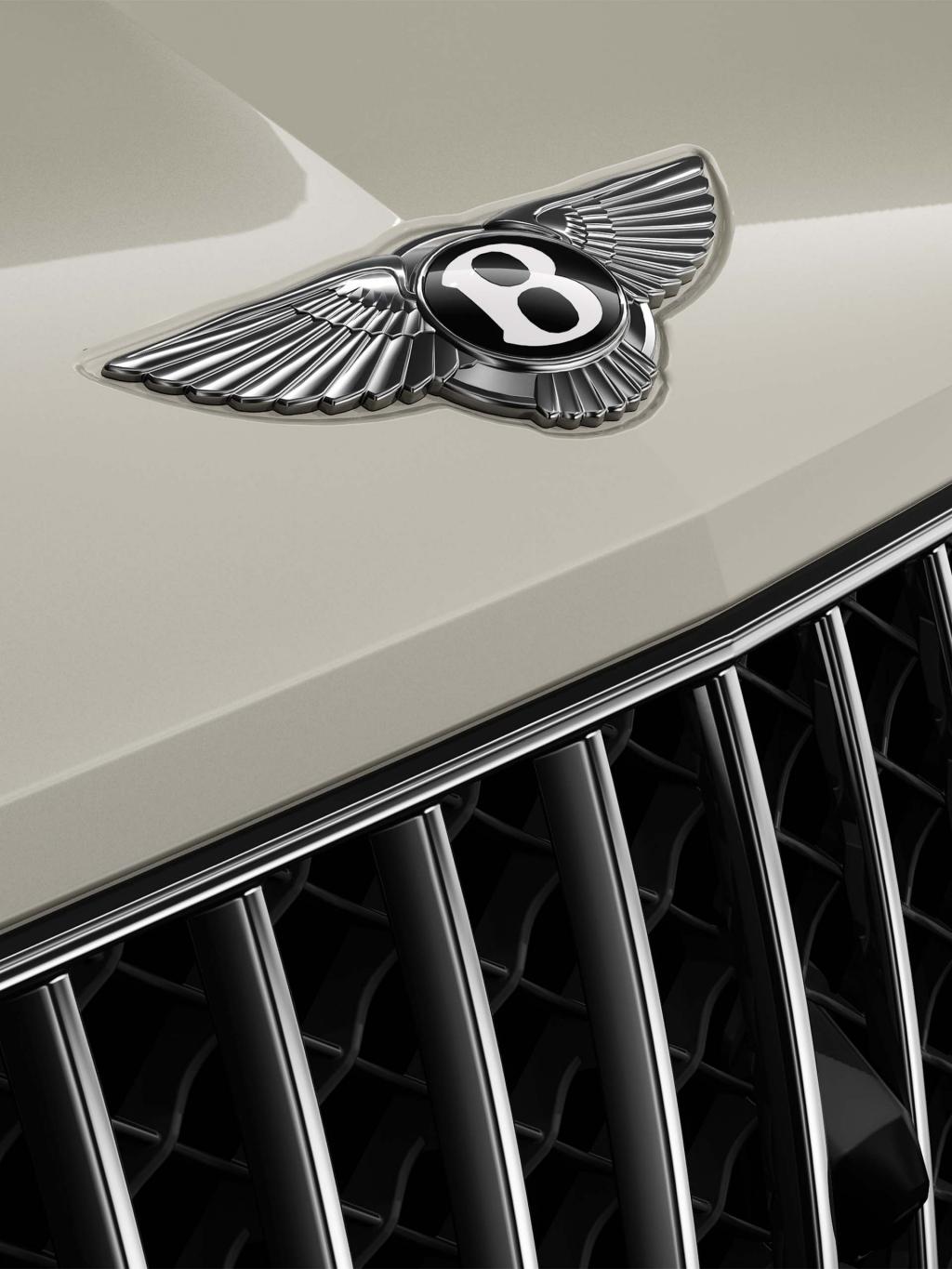 Close up of the Bentley wings on the bonnet of a Bentley Bentayg Azure in White Sand