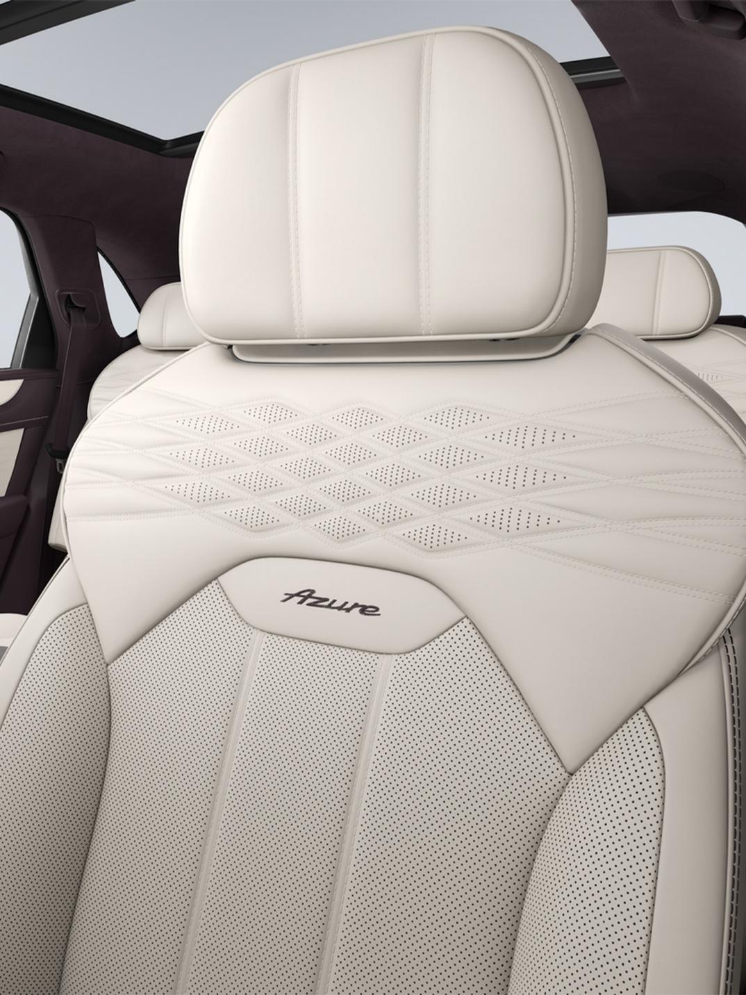 Close up of the drivers seat in a Bentley Bentayga Azure with Linen Main Hide, Damson secondary hide and wellness quilting