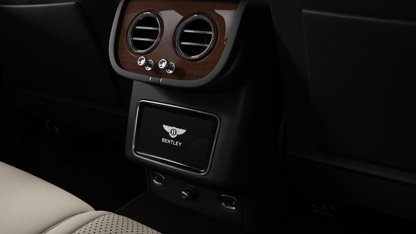 Close up of the touch screen remote available to rear passengers of a Bentley Bentayga SUV