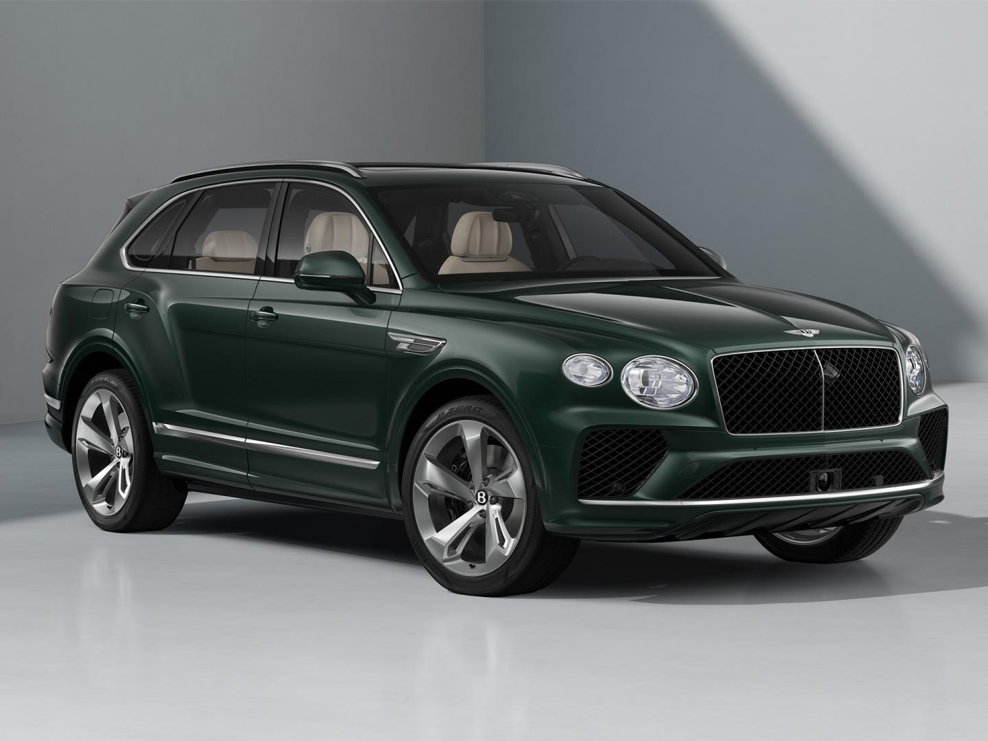 Front three quarter of a Bentley Bentayga SUV in Verdant exterior paint and featuring 22" Five Spoke directional and painted wheels
