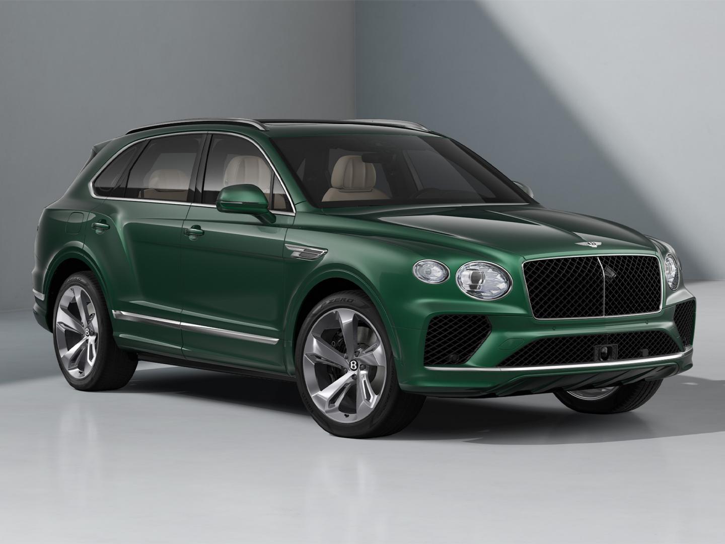 Front three quarter of a Bentley Bentayga SUV in Verdant exterior paint and featuring 22" Five Spoke directional and polished wheels