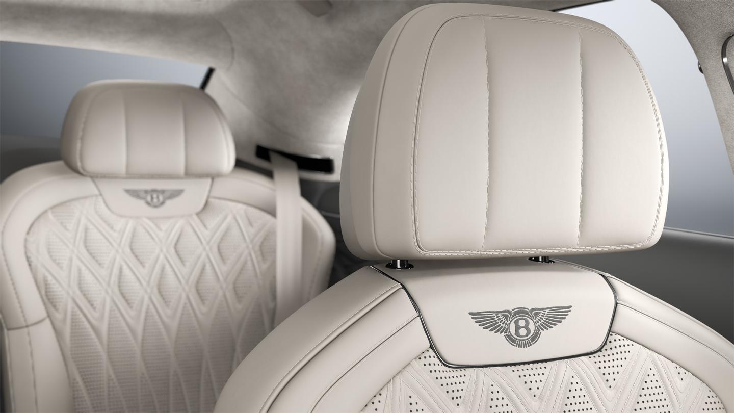 Interior view of the Bentley Flying Spur Azure driver’s seat in Linen and Gravity Grey.