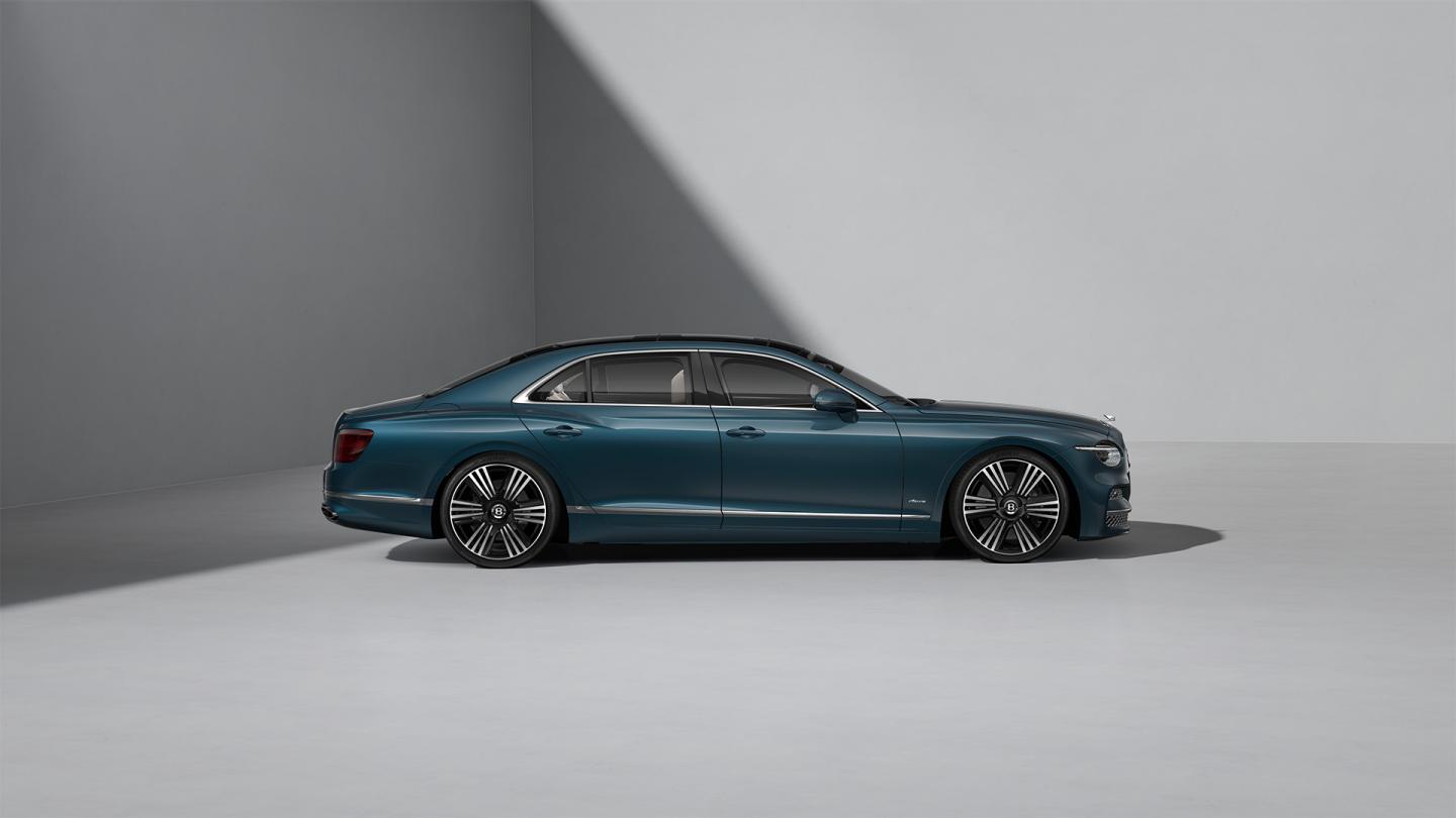 Side profile shot of the Bentley Flying Spur Azure in Dark Teal with Bright Chrome Exterior detailing.