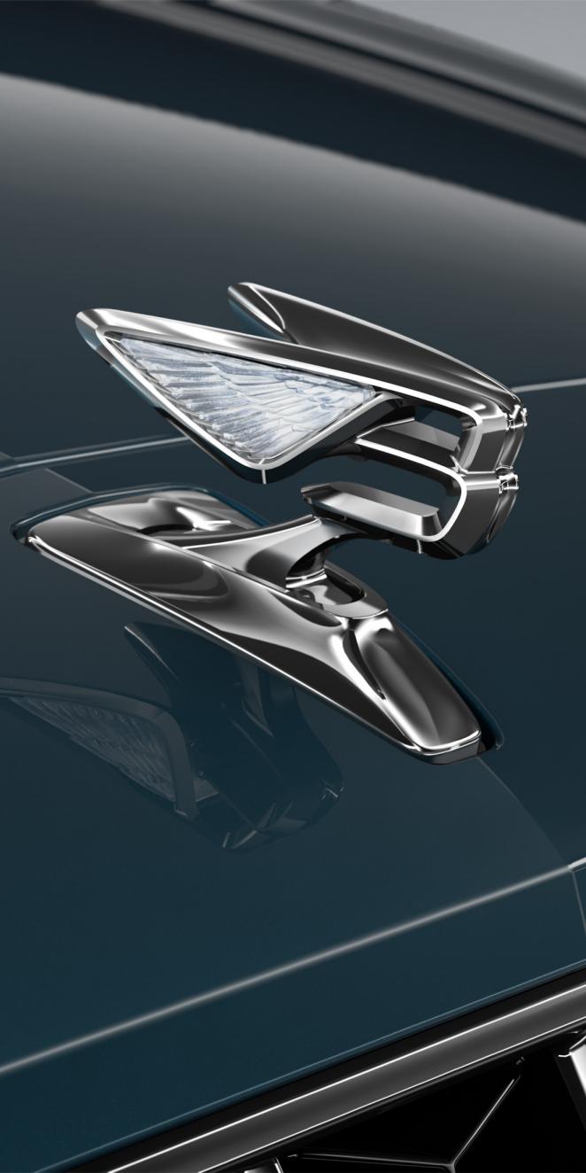 Close-up of the Flying B bonnet mascot on the Bentley Flying Spur Azure in Dark Teal.