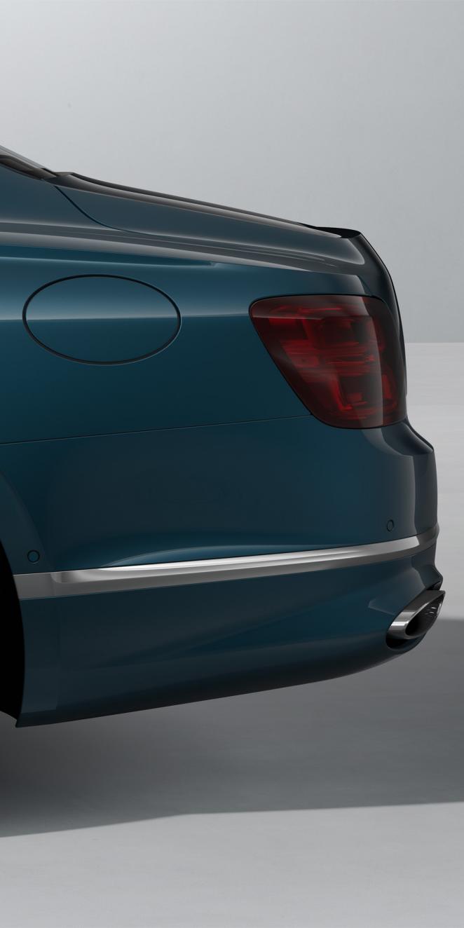 Rear side view of the Bentley Flying Spur Azure in Dark Teal with Bright Chrome Exterior detailing.